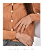 Wholesale single stone ring featuring minimalist zircon detail on a glossy 18K gold-plated brass band in sizes 6 to 9 from junejewelry.com.