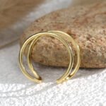 Wholesale twisted open Adjustable Double Bar ring with adjustable double-bar design in 18K gold-plated copper – stylish minimalist jewelry from junejewelry.com.