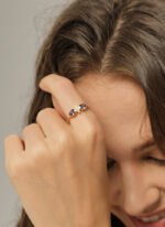 Wholesale purple zircon ring with dual stones and 18K gold-plated brass open design from JuneJewelry.com – INS minimalist style for bulk buyers.