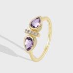 Wholesale purple zircon ring with dual stones and 18K gold-plated brass open design from JuneJewelry.com – INS minimalist style for bulk buyers.