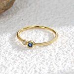 Wholesale double zircon ring – minimalist stackable open ring with two zircon stones and 18K gold plating from JuneJewelry.com, perfect for bulk resale.