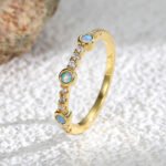 Blue Opal Zircon Ring featuring a round blue opal and zircon accents on a 14K gold‑plated copper band from junejewelry.com—factory‑direct pricing, free shipping.