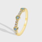 Blue Opal Zircon Ring featuring a round blue opal and zircon accents on a 14K gold‑plated copper band from junejewelry.com—factory‑direct pricing, free shipping.