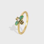 Wholesale enamel bee ring featuring a vintage design with 18k gold plated copper and CZ accents from junejewelry.com