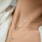 Wholesale sterling silver circle necklace, bracelet, and tassel earrings set with zircon – minimalist platinum plated design from JuneJewelry.com