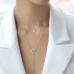 Wholesale sterling silver circle necklace, bracelet, and tassel earrings set with zircon – minimalist platinum plated design from JuneJewelry.com