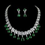 Wholesale geometric cubic zirconia wedding jewelry set with platinum-plated copper necklace and matching earrings, featuring clear, green, and red CZ stones, from JuneJewelry.com
