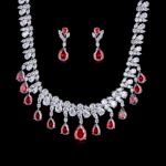 Wholesale geometric cubic zirconia wedding jewelry set with platinum-plated copper necklace and matching earrings, featuring clear, green, and red CZ stones, from JuneJewelry.com