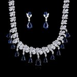 Wholesale geometric cubic zirconia wedding jewelry set with platinum-plated copper necklace and matching earrings, featuring clear, green, and red CZ stones, from JuneJewelry.com