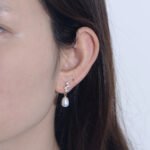 Wholesale French Light Luxury Pearl Studs, S925 sterling silver, with freshwater pearls and zircons, available in 18K gold and platinum plating, Japanese and Korean minimalist elegant design, from junejewelry.com.