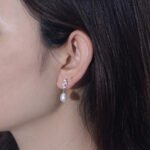 Wholesale French Light Luxury Pearl Studs, S925 sterling silver, with freshwater pearls and zircons, available in 18K gold and platinum plating, Japanese and Korean minimalist elegant design, from junejewelry.com.