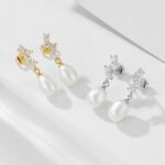 Wholesale French Light Luxury Pearl Studs, S925 sterling silver, with freshwater pearls and zircons, available in 18K gold and platinum plating, Japanese and Korean minimalist elegant design, from junejewelry.com.