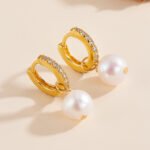Wholesale Zircon Pearl Huggie earrings, 925 sterling silver, with natural freshwater pearls and zircons, 18K gold plated, niche light luxury design, from junejewelry.com.