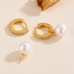 Wholesale Zircon Pearl Huggie earrings, 925 sterling silver, with natural freshwater pearls and zircons, 18K gold plated, niche light luxury design, from junejewelry.com.