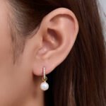 Wholesale Zircon Pearl Huggie earrings, 925 sterling silver, with natural freshwater pearls and zircons, 18K gold plated, niche light luxury design, from junejewelry.com.