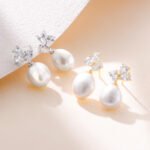 Wholesale Pearl Stud Earrings, S925 sterling silver, with natural pearls and zircon, available in 18K gold or platinum plating, ideal for fashion jewelry wholesale from junejewelry.com.