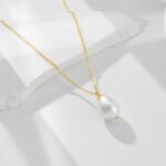 Wholesale sterling silver minimalist baroque pearl pendant necklace – 18K gold plated influencer-style jewelry from JuneJewelry.com