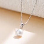 Wholesale sterling silver minimalist pearl pendant necklace with single freshwater pearl – 18K gold or platinum plated from JuneJewelry.com
