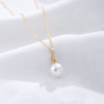Wholesale Zircon Pearl Necklace, S925 sterling silver, with a shell pearl and zircon pendant, available in 18K gold or platinum plating, ideal for fashion jewelry wholesale from junejewelry.com.