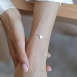 Wholesale sterling silver heart bracelet with polished love charm – minimalist platinum plated 925 chain from JuneJewelry.com