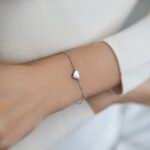 Wholesale sterling silver heart bracelet with polished love charm – minimalist platinum plated 925 chain from JuneJewelry.com