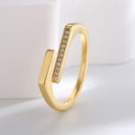 Wholesale open zircon ring with micro-paved stones and 18K gold plating, French minimalist adjustable ring from JuneJewelry.com.