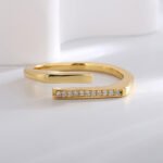Wholesale open zircon ring with micro-paved stones and 18K gold plating, French minimalist adjustable ring from JuneJewelry.com.