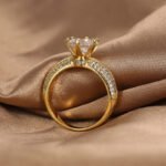 Wholesale six prong zircon ring in 18K gold plated brass – vintage style women’s fashion jewelry from JuneJewelry.com