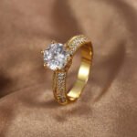 Wholesale six prong zircon ring in 18K gold plated brass – vintage style women’s fashion jewelry from JuneJewelry.com