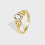Wholesale minimalist CZ ring featuring a French-style design with 18k gold plated copper and sparkling zircon from junejewelry.com