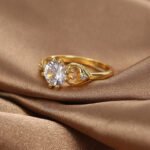 Wholesale minimalist CZ ring featuring a French-style design with 18k gold plated copper and sparkling zircon from junejewelry.com