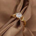 Wholesale minimalist CZ ring featuring a French-style design with 18k gold plated copper and sparkling zircon from junejewelry.com