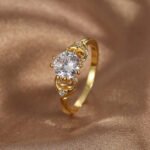 Wholesale minimalist CZ ring featuring a French-style design with 18k gold plated copper and sparkling zircon from junejewelry.com