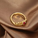 Wholesale elegant heart red zircon ring featuring an 18k gold plated copper design with a prominent red zircon and micro-pave white zircons from junejewelry.com