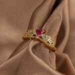 Wholesale elegant heart red zircon ring featuring an 18k gold plated copper design with a prominent red zircon and micro-pave white zircons from junejewelry.com