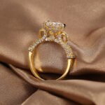 Wholesale retro design zircon ring featuring an 18k gold plated copper design with sparkling zircons from junejewelry.com