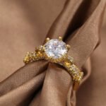 Wholesale retro design zircon ring featuring an 18k gold plated copper design with sparkling zircons from junejewelry.com