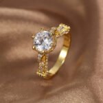 Wholesale retro design zircon ring featuring an 18k gold plated copper design with sparkling zircons from junejewelry.com