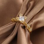 Wholesale geometric zircon ring featuring an 18k gold plated copper design with sparkling white zircons from junejewelry.com