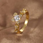 Wholesale geometric zircon ring featuring an 18k gold plated copper design with sparkling white zircons from junejewelry.com
