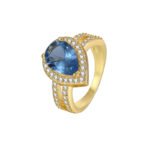 Wholesale French modern minimalist teardrop blue zircon ring for women, 18K gold plated copper with a sparkling blue zircon from junejewelry.com