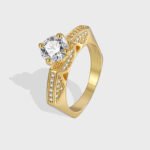 Wholesale minimalist zircon ring, 18K gold plated copper, with a sparkling zircon and unique niche design, ideal for fashion jewelry wholesale from junejewelry.com.