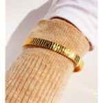 Wholesale gold cuff bracelet with vertical striped texture, 18K gold plated open bangle from JuneJewelry.com – minimalist luxury wrist jewelry.