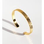 Wholesale gold cuff bracelet with vertical striped texture, 18K gold plated open bangle from JuneJewelry.com – minimalist luxury wrist jewelry.