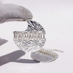 Wholesale Statement Earrings, copper material, with a unique spliced circular faceted pattern, available in 18K gold or platinum plating, ideal for fashion jewelry wholesale from junejewelry.com.