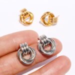 Wholesale Bold Earrings, copper material, with a unique double-ring chain knot geometric design, available in 18K gold or platinum plating, ideal for fashion jewelry wholesale from junejewelry.com.