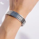 Wholesale shiny chain bracelet with open cuff design in 18K gold and platinum plated brass from JuneJewelry.com – fashion jewelry for bulk buyers.