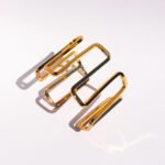 Wholesale geometric open bracelet in bold spiral hollow design, 18K gold or platinum plated brass cuff from JuneJewelry.com – cross-border statement jewelry.