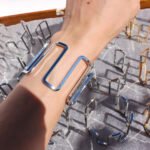 Wholesale geometric open bracelet in bold spiral hollow design, 18K gold or platinum plated brass cuff from JuneJewelry.com – cross-border statement jewelry.