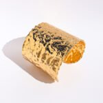 Wholesale statement bangle bracelet with foil-wrinkle texture, wide metal open cuff plated in 18K gold or platinum – bold fashion jewelry from JuneJewelry.com.